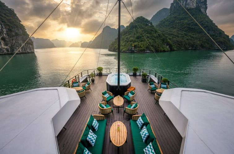 Catamaran sailing through limestone karsts