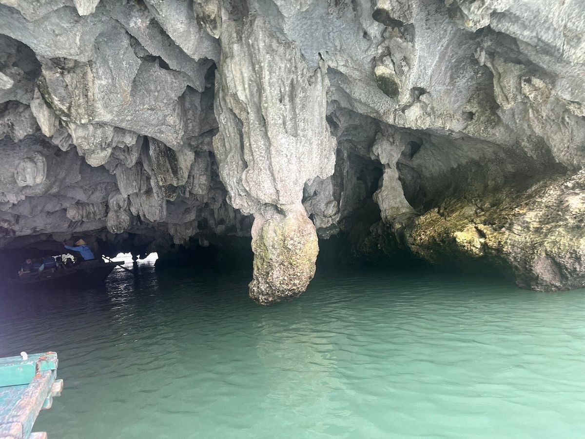 An emerald sea cave in the bay